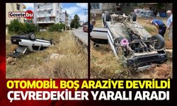 Otomobil boş araziye devrildi, çevredekiler yaralı aradı