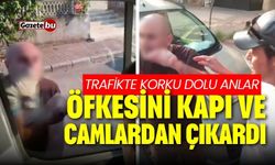 Trafikte korku dolu anlar! Öfkesini kapı ve camlardan çıkardı