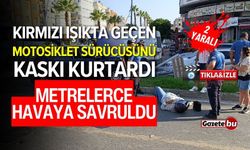 Kırmızı ışıkta geçen motosiklet sürücüsünü kaskı kurtardı