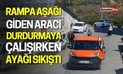 Rampa Aşağı Giden Aracı Durdurmaya Çalışırken Ayağı Sıkıştı