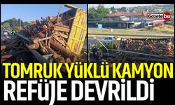Tomruk Yüklü Kamyon Refüje Devrildi