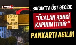 Bucak’ta Üst geçide “Öcalan Hangi Kapının İtidir” yazılı pankart asıldı