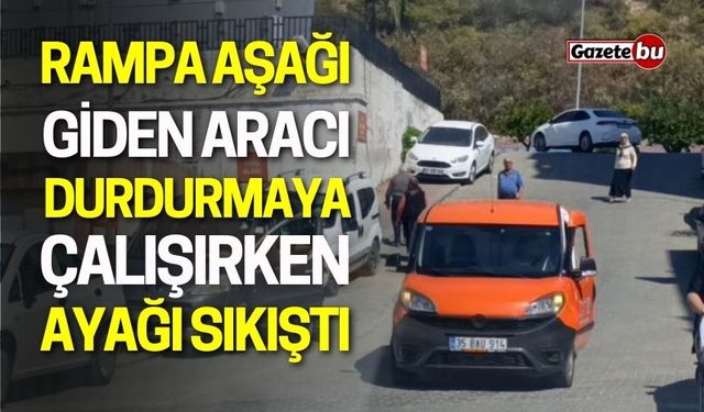 Rampa Aşağı Giden Aracı Durdurmaya Çalışırken Ayağı Sıkıştı